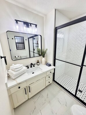 Shower, hair dryer, towels, soap