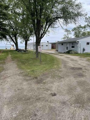 Property grounds - Charming Lake Huron Cottage | Pavilion + Firepit (Iosco County)