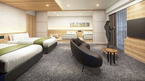 A modern hotel room with a large bed, a sofa, a TV, and a sliding door. - Daiwa Roynet Hotel Matsue-ekimae (Matsue)