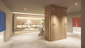 A modern interior with a reception desk, seating area, and a decorative wooden partition. - Daiwa Roynet Hotel Matsue-ekimae (Matsue)
