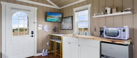 Fridge, microwave, coffee/tea maker, paper towels