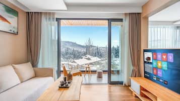 Suite Deluxe, vistas a la montaña | Sala de estar