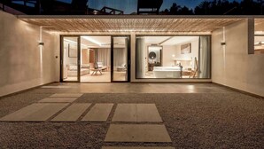 A modern building with a covered entrance, a visible bathroom with a bathtub, and a well-lit interior. - Qixiannv Homestay Xiannv Mountain Shop (Chongqing)