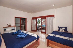 Deluxe driepersoonskamer, Meerdere bedden | Gratis wifi, beddengoed