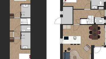 A floor plan of a hotel room with a bed, a desk, a chair, a small table, and a bathroom.