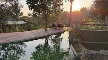 Outdoor pool, open 7:00 AM to 9:00 PM, pool umbrellas, pool loungers