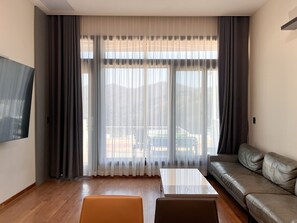 Habitació quàdruple, balcó | Sala d'estar