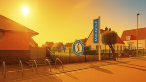 Ein Gebäude mit einem Schild, auf dem 'MINIGOLF' steht, und einem kreisförmigen Logo mit der Aufschrift 'ANNOR'S NIMIGOWI'.