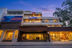 A multi-story building with a sign for 'Fabi Hotels' and a large glass storefront. - Fabhotel Park View (New Delhi)