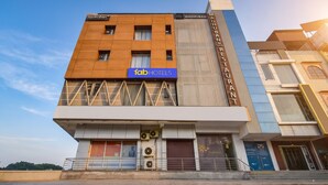 A multi-story building with a sign for 'fab hotels' on the ground floor, a 'Madhuban Restaurant' on the second floor, and a 'Madhuban' sign on the facade. - Fabhotel Madhuban (Jaipur)