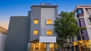 A modern hotel with a flat facade, multiple windows, and a sign indicating it is part of the Fab Hotels chain. - Fabhotel Mansarovar Retreat (Jaipur)