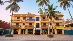 A multi-story hotel with a reception area, a guesthouse, and a visible sign for 'fabHOTELS'. - Fabhotel Shadowline (Panaji)