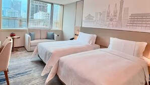 A modern hotel room with two beds, a sofa, a desk, and a large window with a cityscape view. - China Mayors Plaza Hotel (Guangzhou)