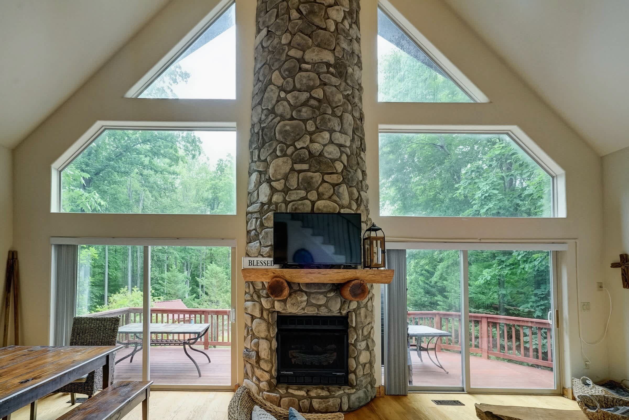 Open, Airy, Unforgettable - Floor-to-ceiling windows flood the great room with natural light and lake views.
