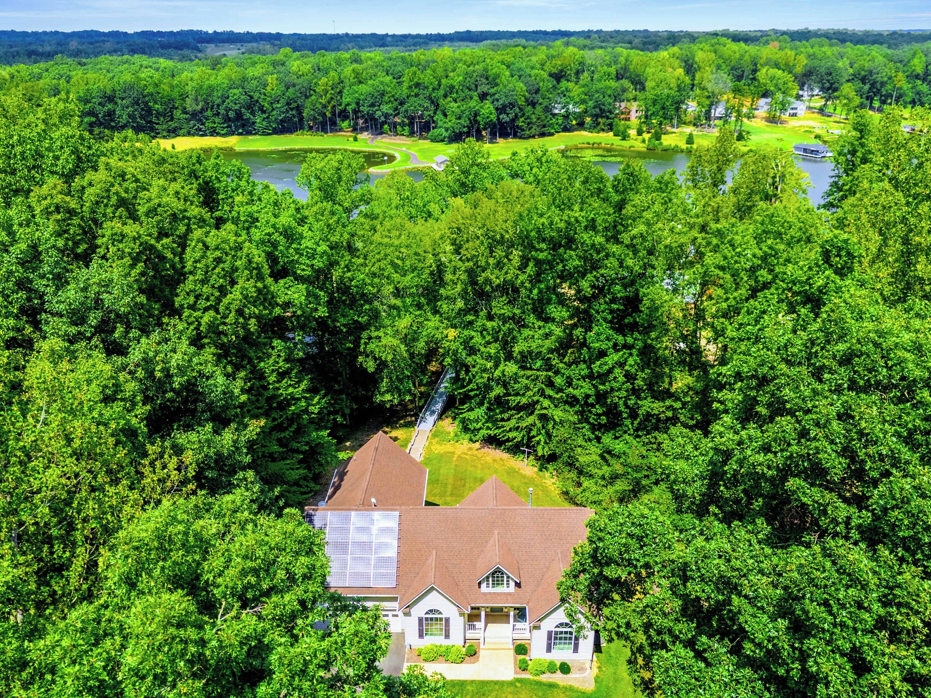 The full property from the air: house, yard, dock, and neighborhood. Lake Anna at your doorstep.