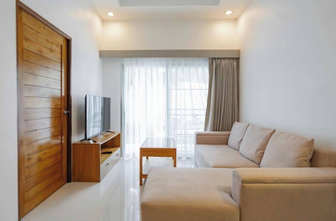 Departamento, balcón, vista a la alberca | Área de sala de estar