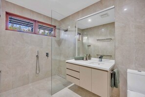 Shower, hair dryer, towels, soap