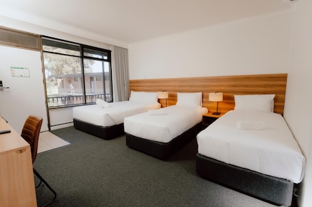 Family Quadruple Room | Blackout drapes, iron/ironing board, free WiFi. Canberra Park Motel