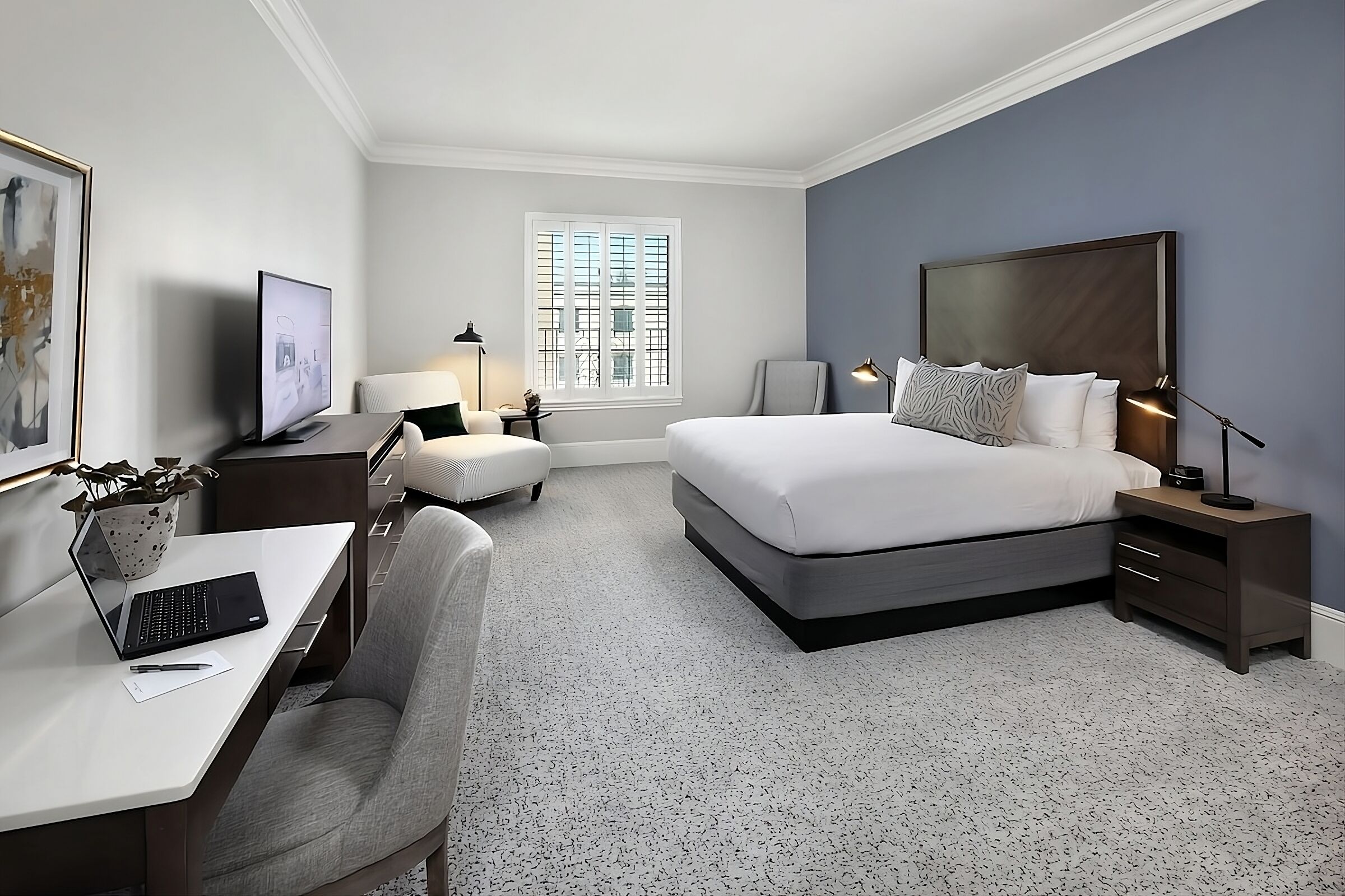 Unwind in a spacious king room with dedicated work desk.