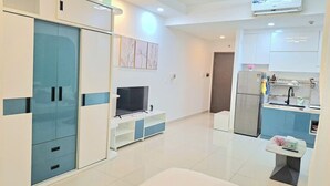 A modern kitchen with a built-in oven, a refrigerator, and a sink. - Way home studio sunrise city view (Thành phố Hồ Chí Minh)