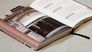 A book with a visible page on a textured surface. - Studio Champs-Élysées Arc Retreat (Paris)