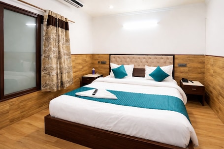 Deluxe Double Room, Balcony, City View | Egyptian cotton sheets, premium bedding, desk, laptop workspace. Roomshala Vasant Villas- ILBS Hospital