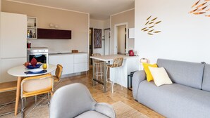 A modern apartment with a kitchen, dining area, and living room. - Sirio Vista Blu Apartment by Interhome (San Lorenzo al Mare)