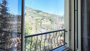 A balcony with a view of a hilly landscape. - Belle Vue by Interhome (Alassio)
