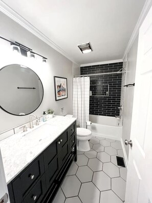 Shower, jetted tub, hair dryer, towels