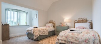 A stunning Edwardian-style country residence offering contemporary luxury in a tranquil village setting. Perfect for large groups, family gatherings, or multi-generational stays