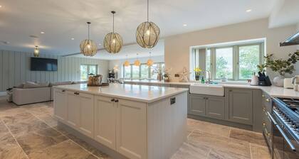 A stunning Edwardian-style country residence offering contemporary luxury in a tranquil village setting. Perfect for large groups, family gatherings, or multi-generational stays