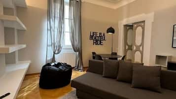 Apartment, City View | Living area | Flat-screen TV
