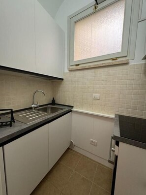 Apartamento, vista para a cidade | Cozinha privada