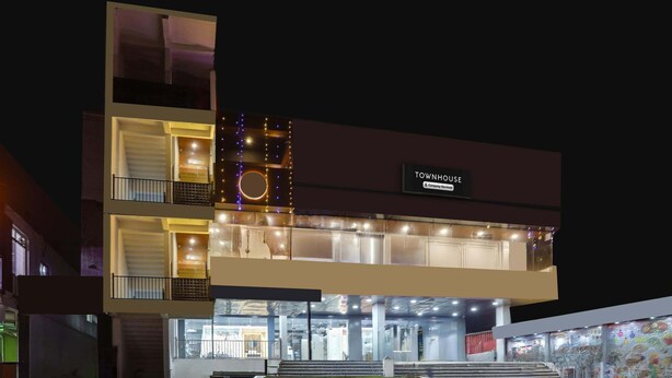 A multi-story building with a sign reading 'TOWNHOUSE.' - Classic With Balconyhaldwani INN (Haldwani)
