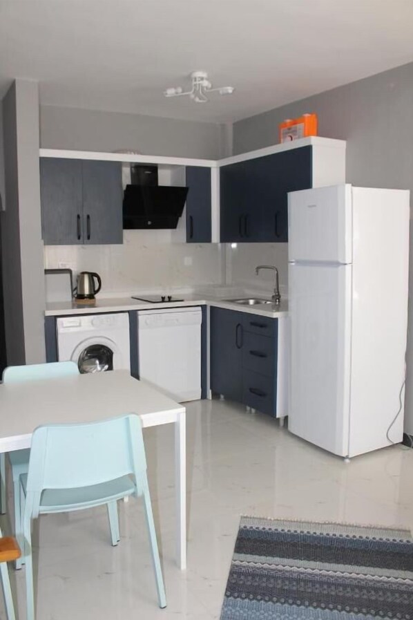 Basic Condo, 2 Bedrooms | Private kitchen | High chair