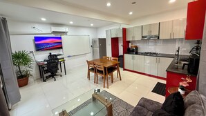 A modern apartment with a dining area, kitchen, and living space. - 1 Bedroom Apartment in Namadi Height, SUVA (Suva)