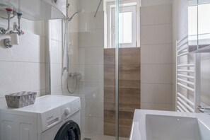 Shower, hair dryer, towels, soap
