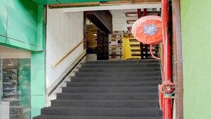 A staircase leading to an interior space with a visible door at the top. - Super Deluxe Room Hotel Ballian's (Prayagraj)