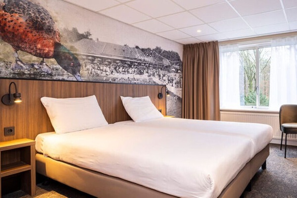 Sink into the plush bed and wake to gentle light.