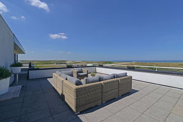 Soak up ocean breezes on the expansive private rooftop terrace.