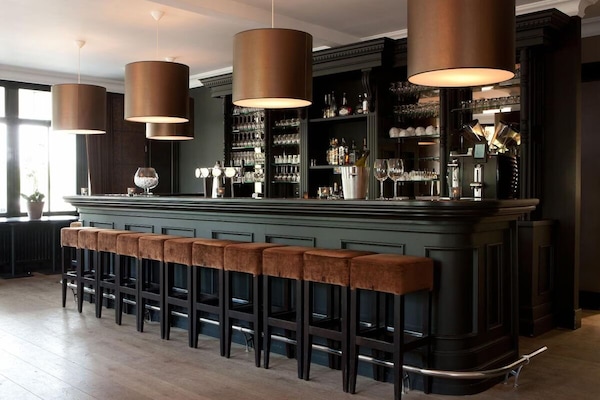 Settle in for crafted cocktails at the stylish, intimate bar.