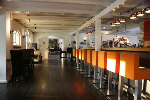 Sip cocktails at the lively bar with plush seating.