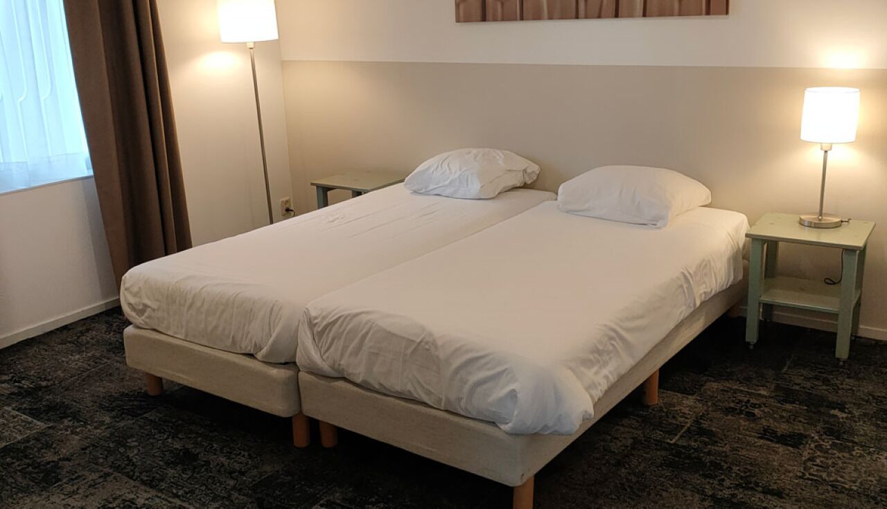 Drift off in a simple room designed for restful nights.