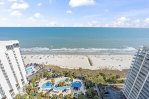 A resort with a pool, beach, and ocean view. - 2002p 2 Bedroom Condo (Myrtle Beach)