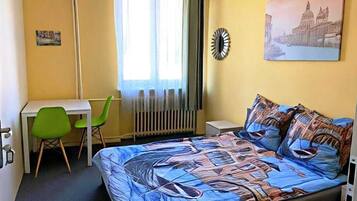 Comfort Room, City View | Blackout drapes, iron/ironing board, free WiFi
