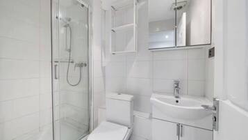 Shower, towels, soap, toilet paper