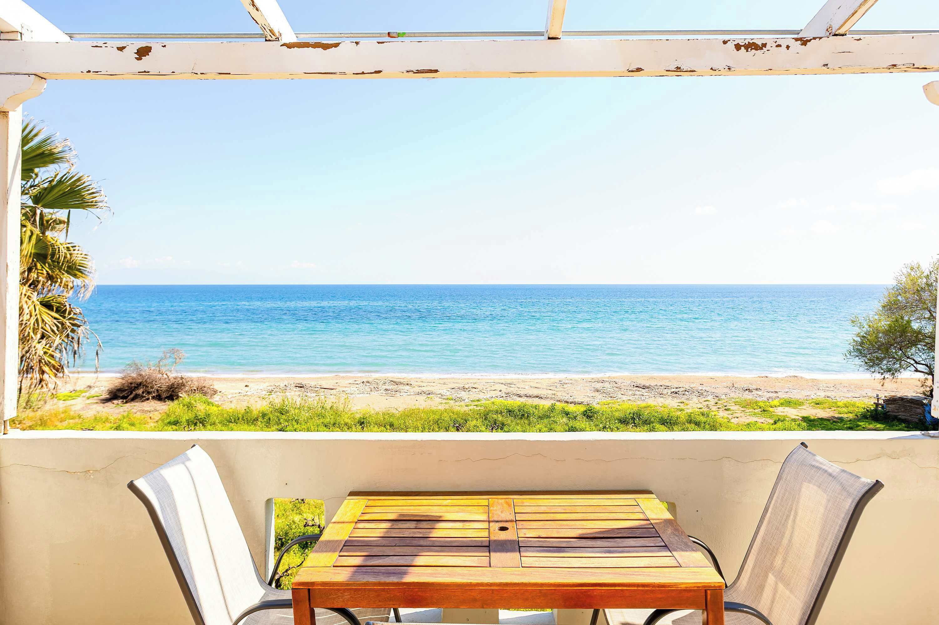 Spacious Balcony with Dining Table and Panoramic Sea View