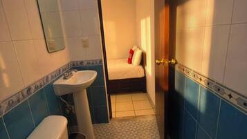 Classic Single Room | Bathroom | Shower, rainfall showerhead, towels, soap