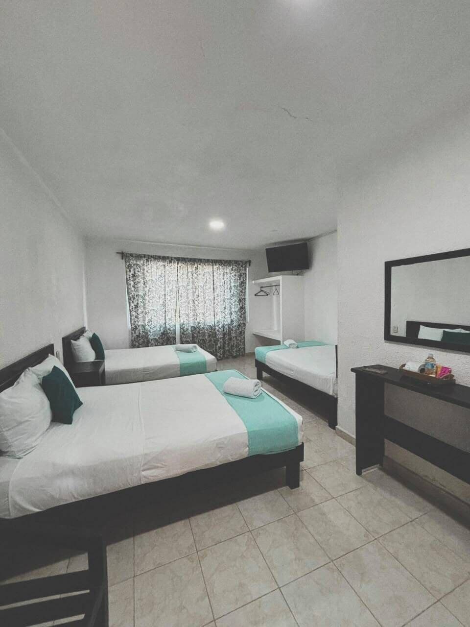 Classic Triple Room, City View | Down comforters, iron/ironing board (on request), WiFi (free)