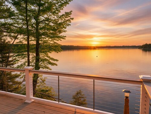 “Waterfront cabin w/ private deck overlooking the ocean & amazing sunset views.”
